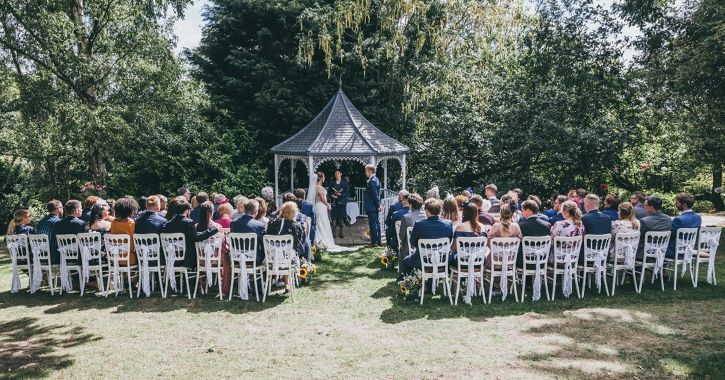 A wedding outside in the grounds of Crook Hall and Gardens